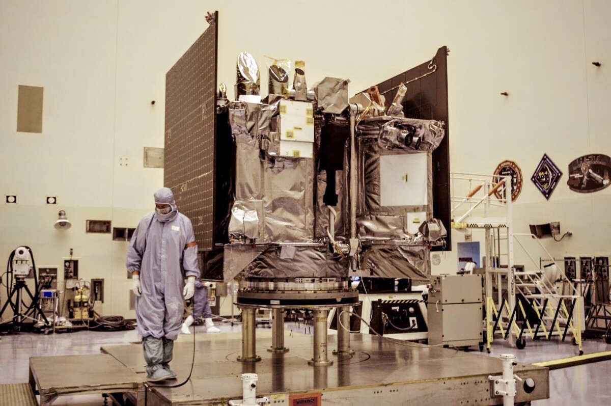 The black-wrapped portion of the satellite is its TAGSAM arm, which stands for touch-and-go sample acquisition mechanism