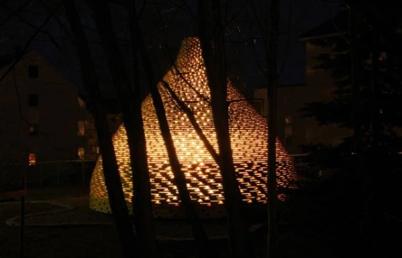 The fire pit by Haugen/Zohar lights up the garden at night