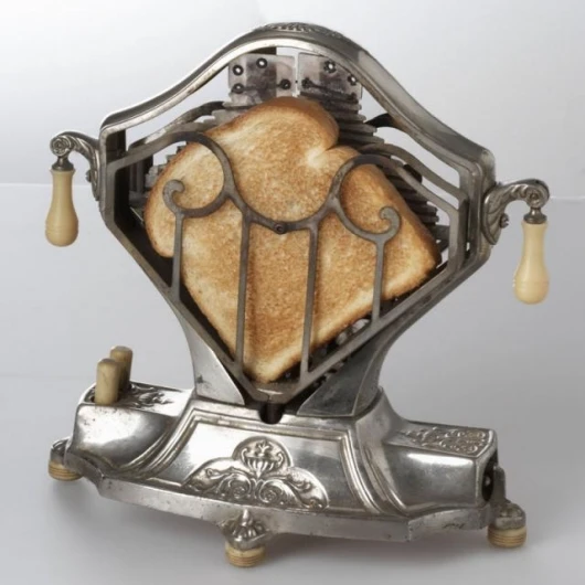 The heart-shaped Sweetheart toaster was developed in the 1920s. It used swinging doors activated by a side button to flip the toast around. A beautiful appliance that was often showcased as the centerpiece of the kitchen table while toasting bread, its d