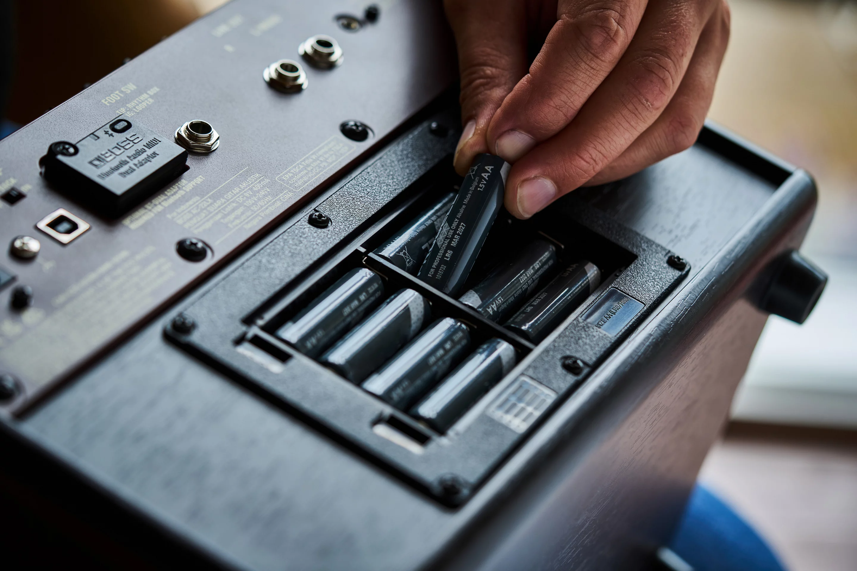 The AC-22LX's AC adapter can be plugged into a wall outlet, or the acoustic amplifier can run on eight AA-sized batteries
