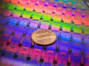 Processors on an Intel 45nm Hafnium-based High-k Metal Gate ''Penryn'' Wafer photographed with a penny