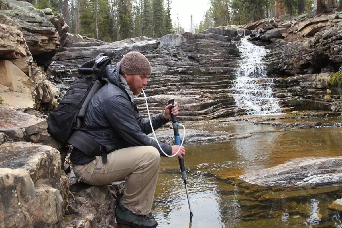 The PurTrek trekking pole/water purifier in use