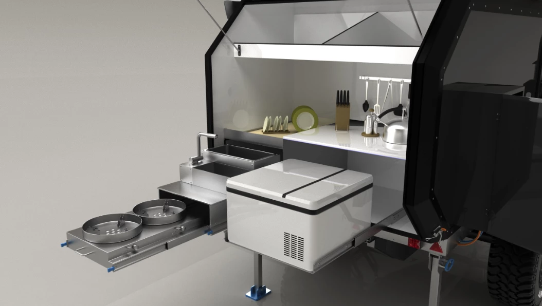 The kitchen comes with dual burners, a sink, worktop and storage space and a slide-out for an available fridge