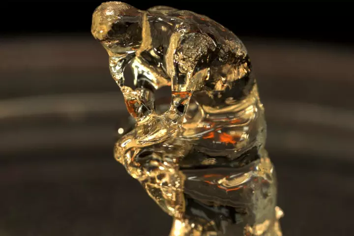 A miniature version of the statue "The Thinker," created using the new 3D-printing system
