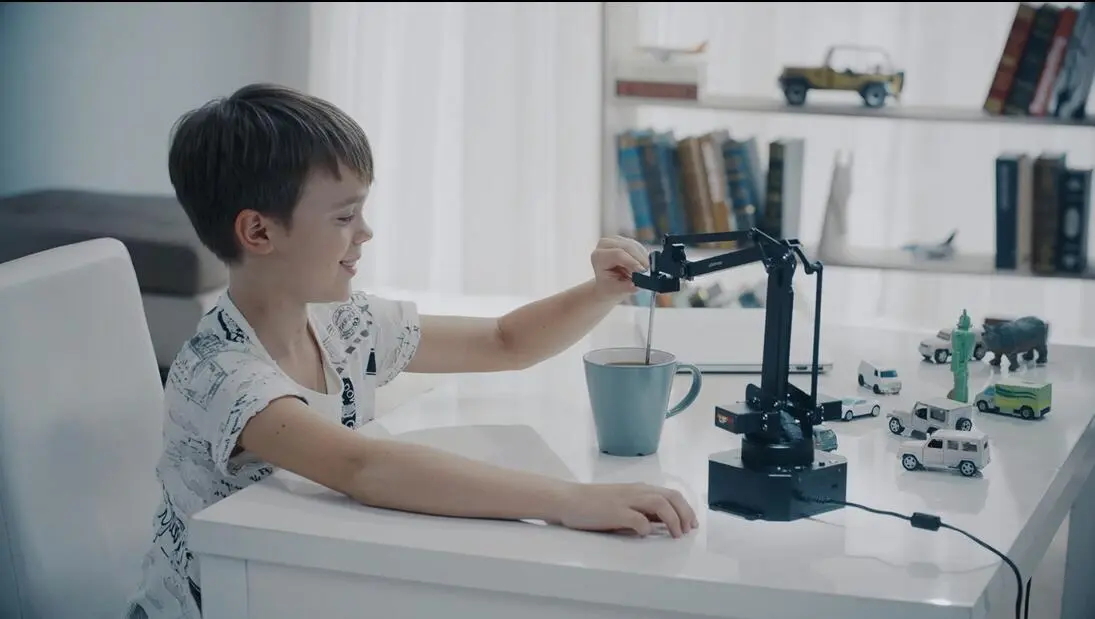 The uArm Swift robotic arm can be taught a movement by manually guiding the robot through the action