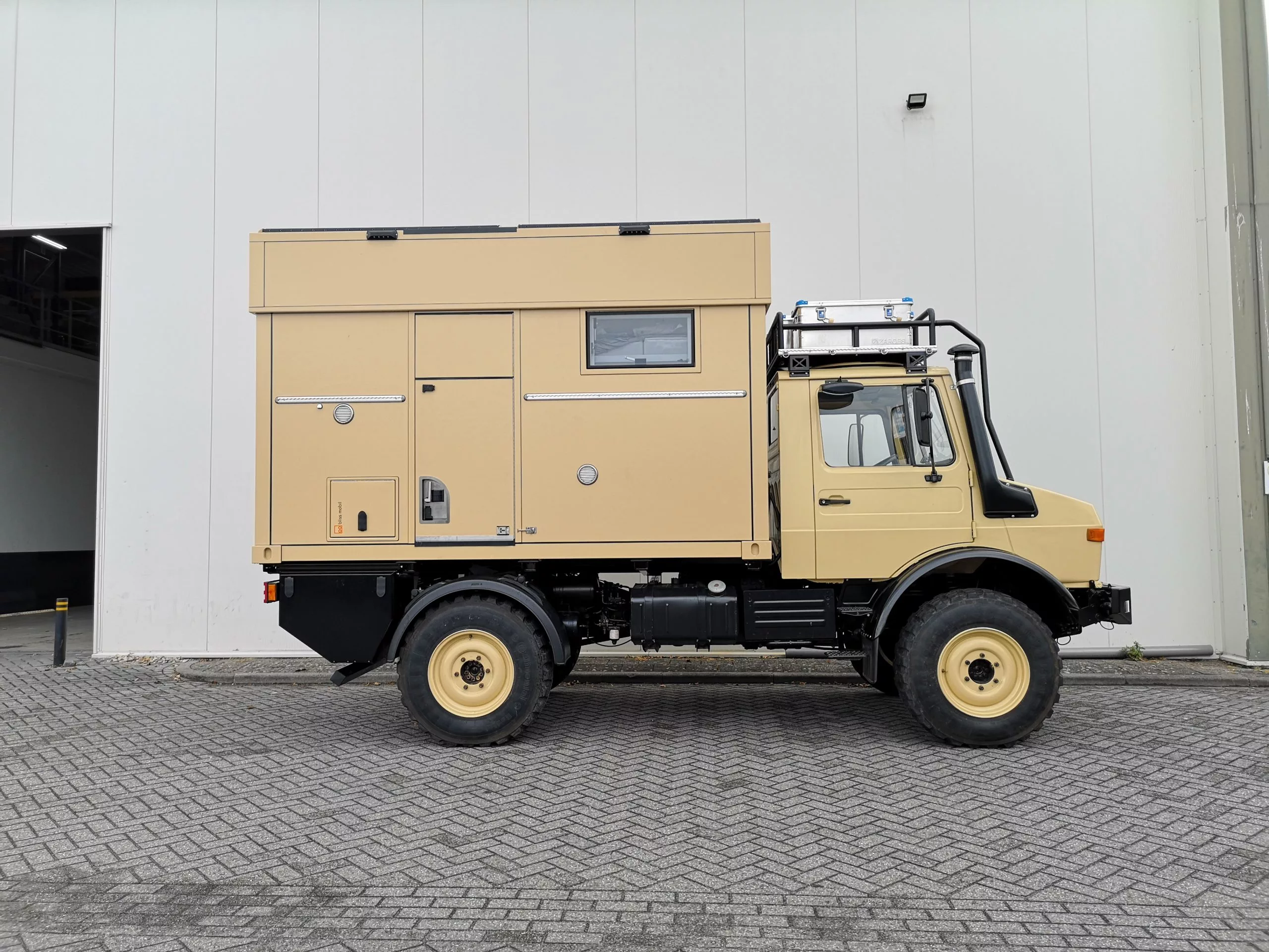 The lifting top makes for a lower clearance and center of gravity during driving while providing standing room when camping