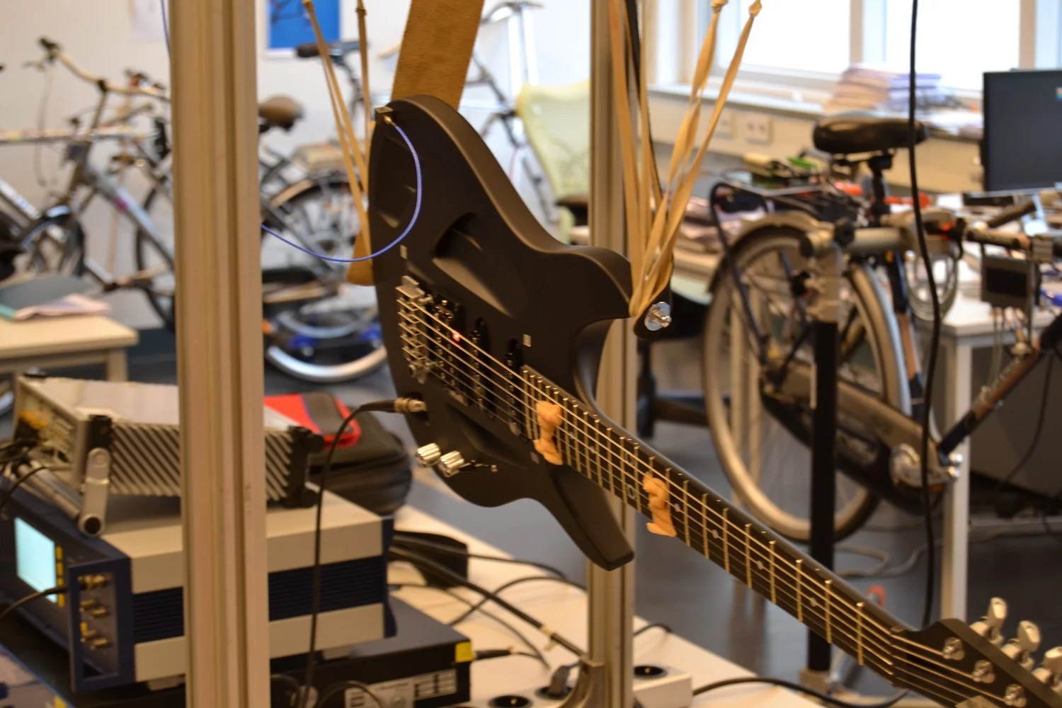 An Aristides Arium guitar undergoing acoustic testing