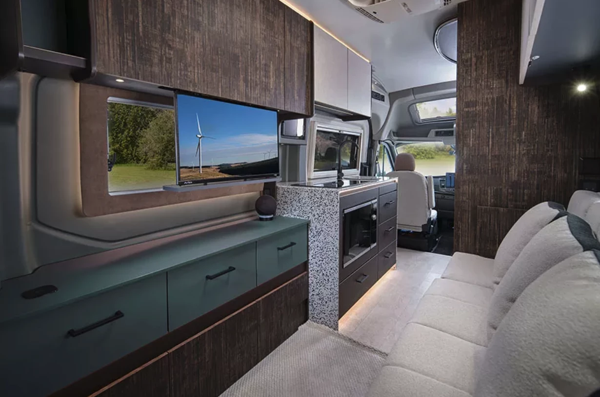 A more relaxing breed of rear lounge, the transformable multifunctional Endeavor EV lounge starts off with a single sofa facing the window/power-drop TV