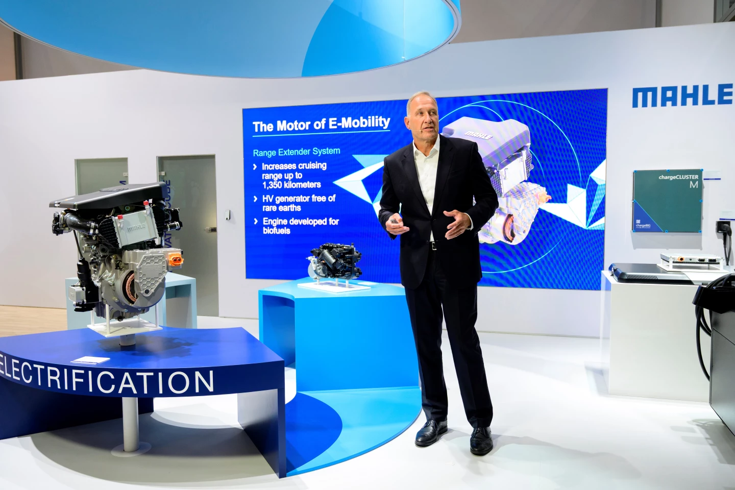 Mahle CEO Arnd Franz gives a keynote at IAA Mobility and focuses on various efficiency-boosting initiatives, including the range extender to his right