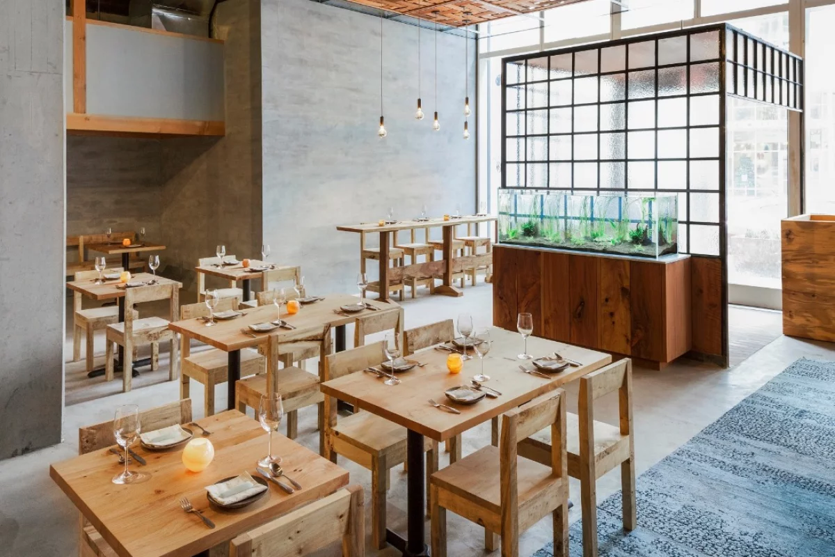Among the features of the Perennial's dining room are reclaimed lumber, a 100 percent recycled and recyclable rug, recycled tiles, plaster made from marble-processing waste and recycled glazing