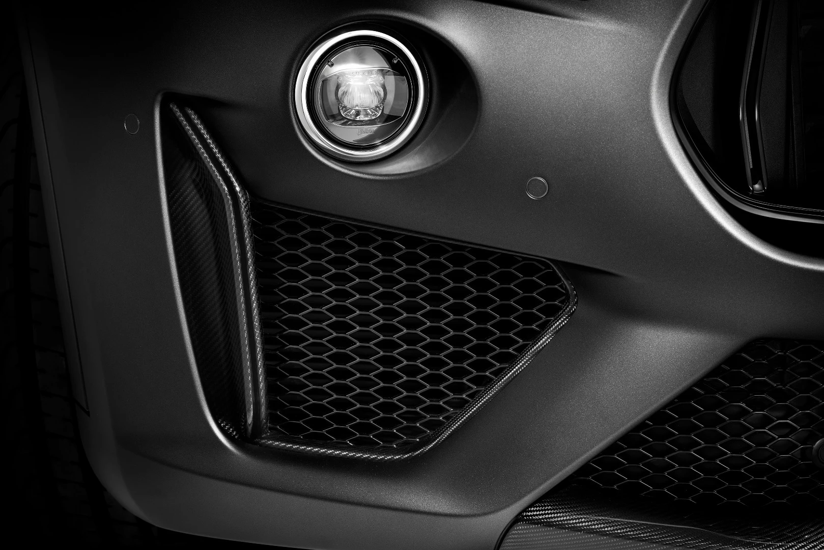 The more aggressive face includes carbon fiber blades