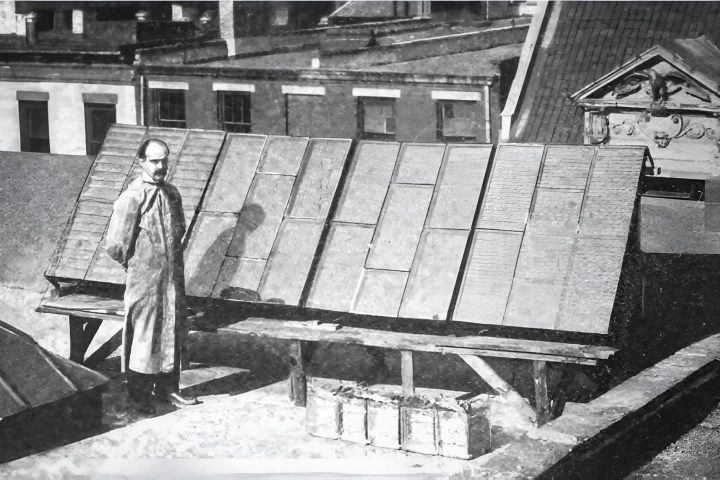 George Cove stands with his third solar array. From "Generating electricity by the sun's rays"