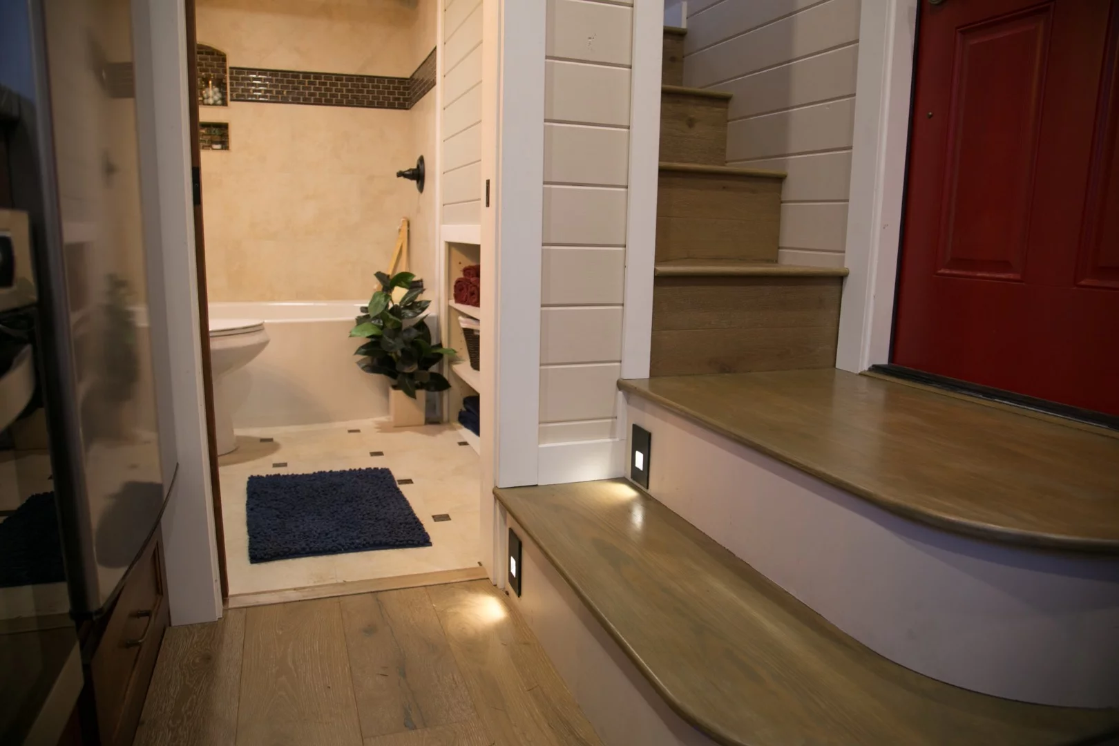 The stairs that lead to the Theater Home's master bedroom include some theater-style lighting