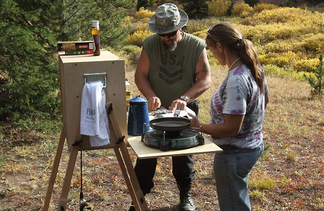 Unlike a cardboard box of kitchen gear, My Camp Kitchen gives you a place to prepare meals