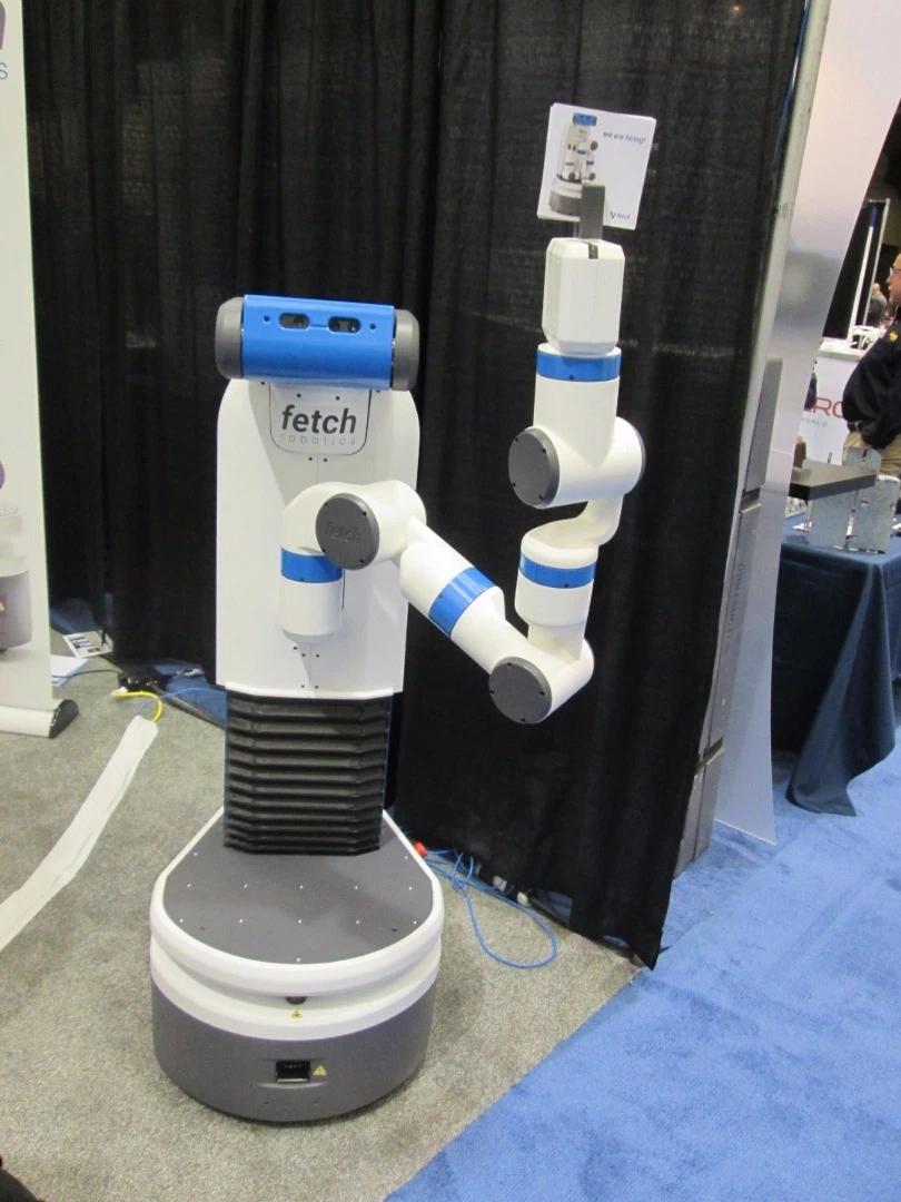 Fetch manipulator robot hands out brochures
