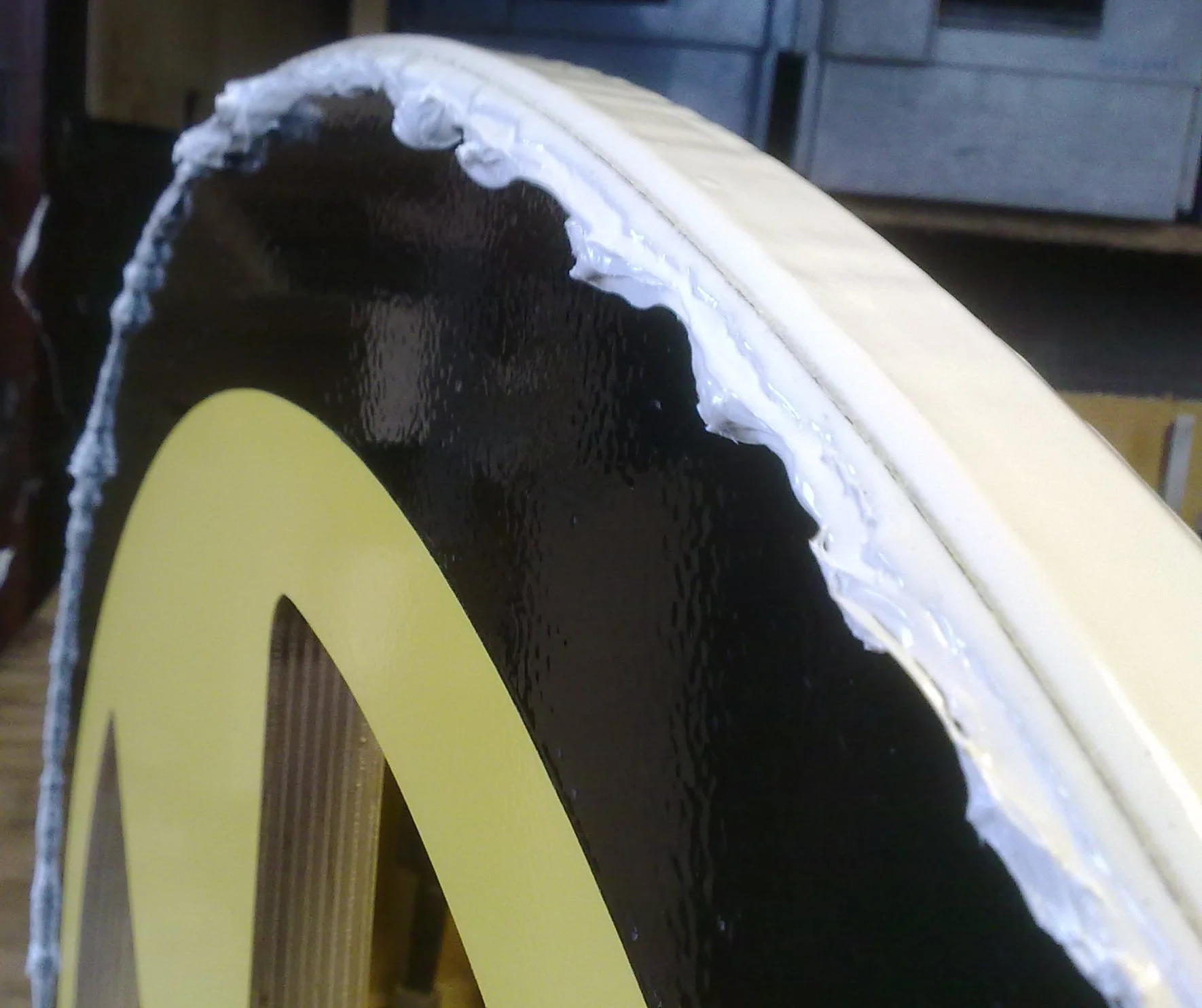The wheel rims have been coated with adhesive to give the bike some traction