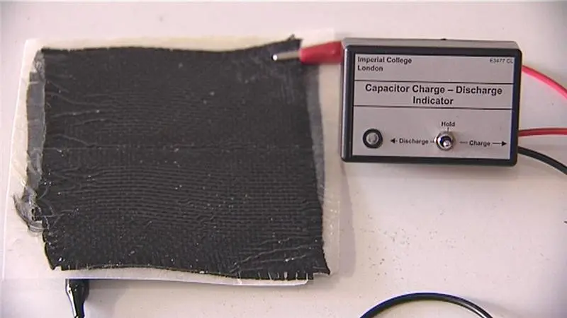 The composite material releasing electrical energy to power a small light (Photo courtesy of Imperial College London)