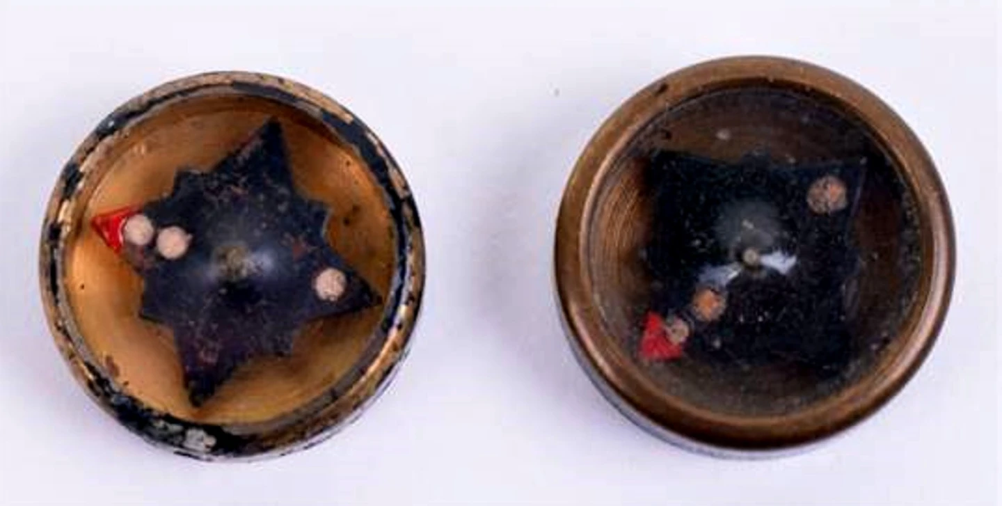 A button compass used by spies and escaped POWs
