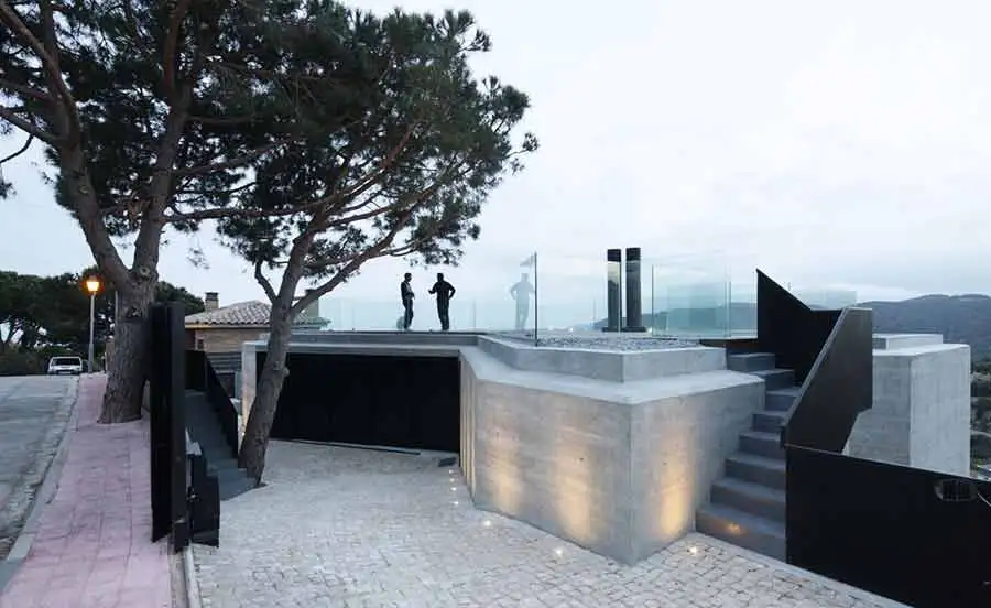 X House as seen from the rear, with an entrance and roof terrace