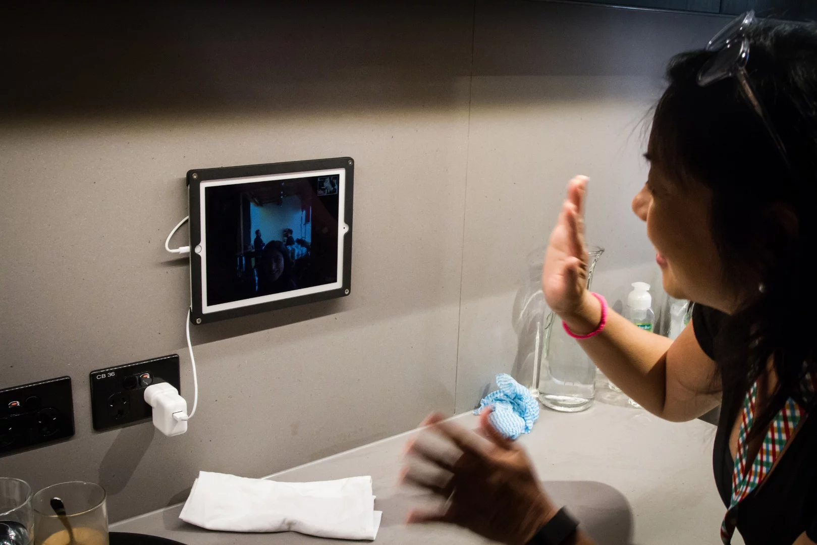 In the kitchen an tablet acts as a portal to the other side of the world, streaming live video from Slack's Vancouver office