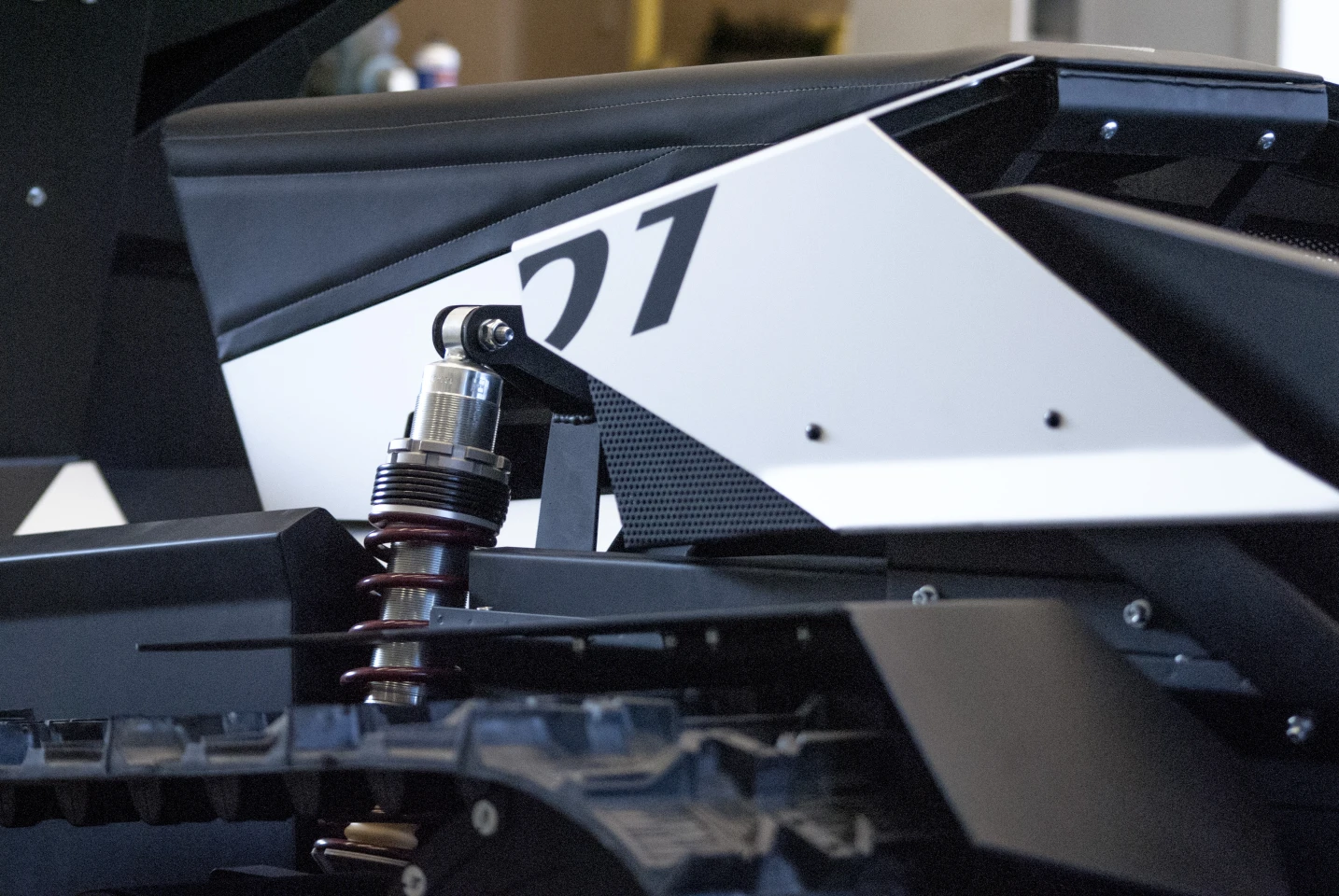 A close up of the coil-over damper and rocker arm front suspension of the Ardenner