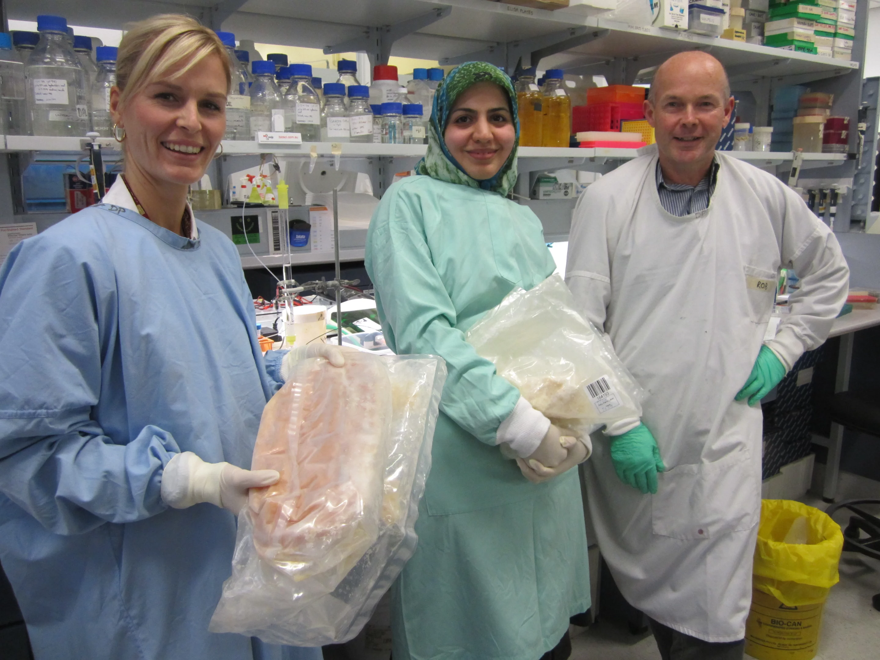Dr. Marit Kramski (left) and colleagues Behnaz Heydarchi and Rob Center, with bags of frozen HIV-fighting milk (Photo: Fresh Science)