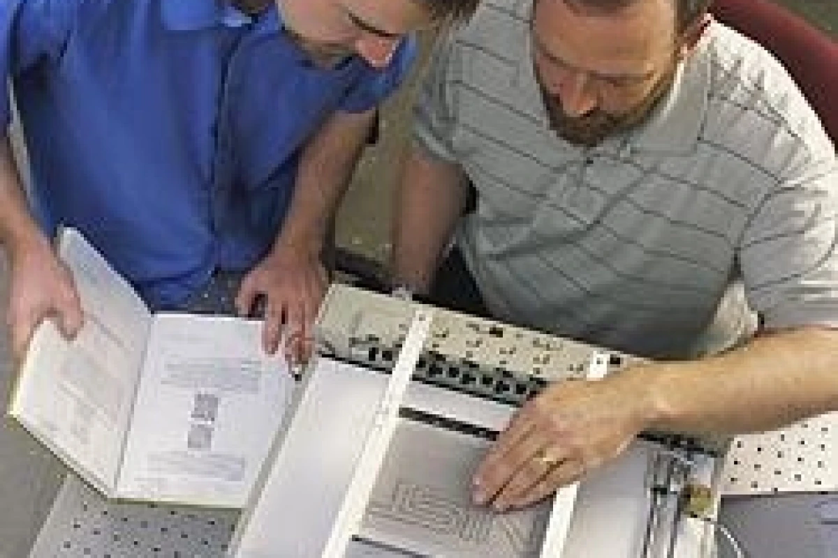 Researchers John Roberts (right) and Oliver Slattery (left) using the tactile graphic display device.