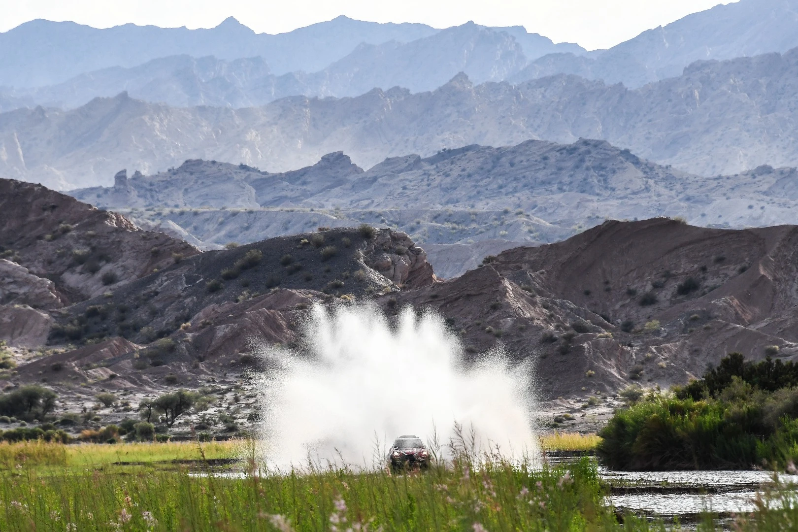 Boris Garafulic and Filipe Palmeiro making a huge splash with their Mini, but a tiny and very temporary disturbance to the giant landscape behind them