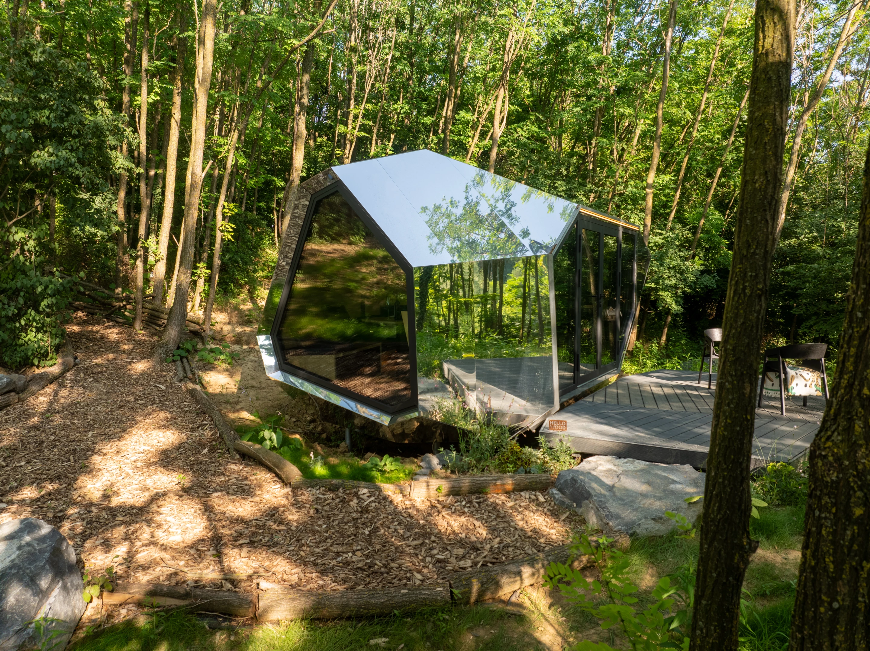 The Pebl Grand features a boulder-shaped exterior that can feature a mirrored finish, as shown, or alternatively stone or wood