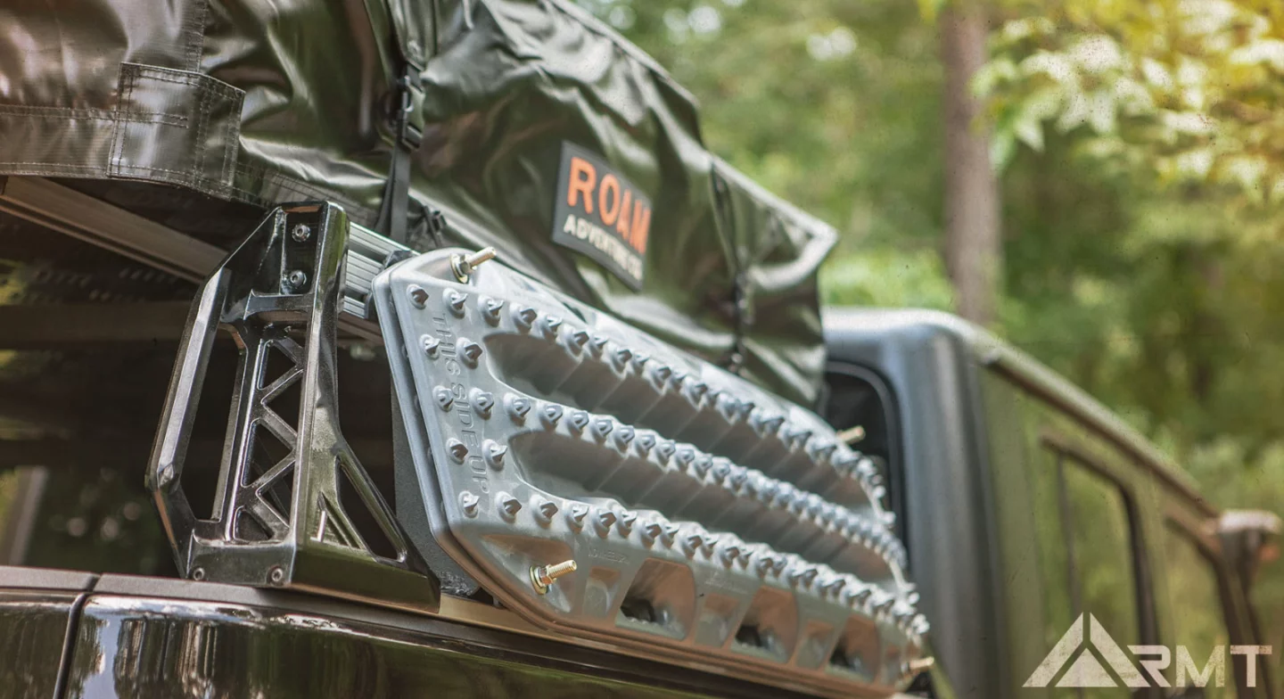 Many of the accessories that fit on the RMT Overland rack on the Gladiator include off-the-shelf items like the ROAM Adventures tent and MaxTrax mud boards