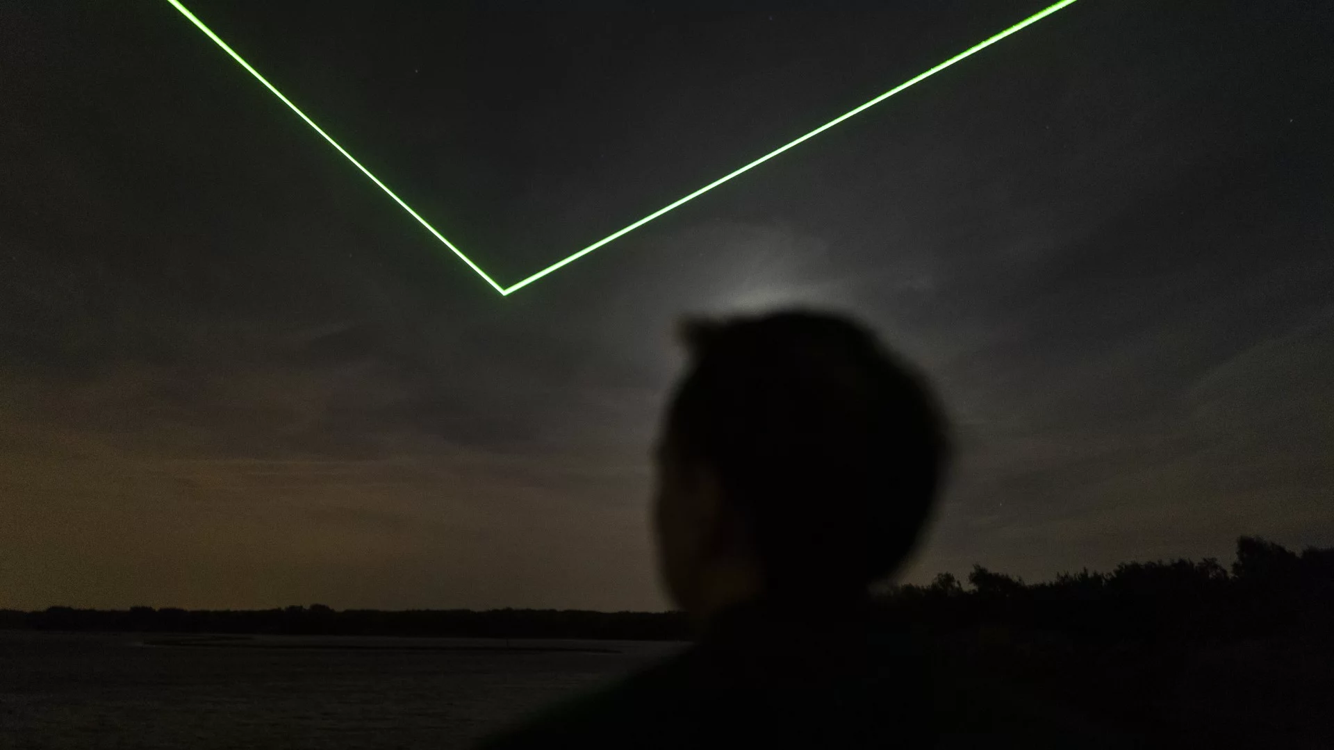 Lines of LEDs form arrows that pinpoint space debris as it shoots across the sky for Studio Roosegarde's Space WÅaste Lab