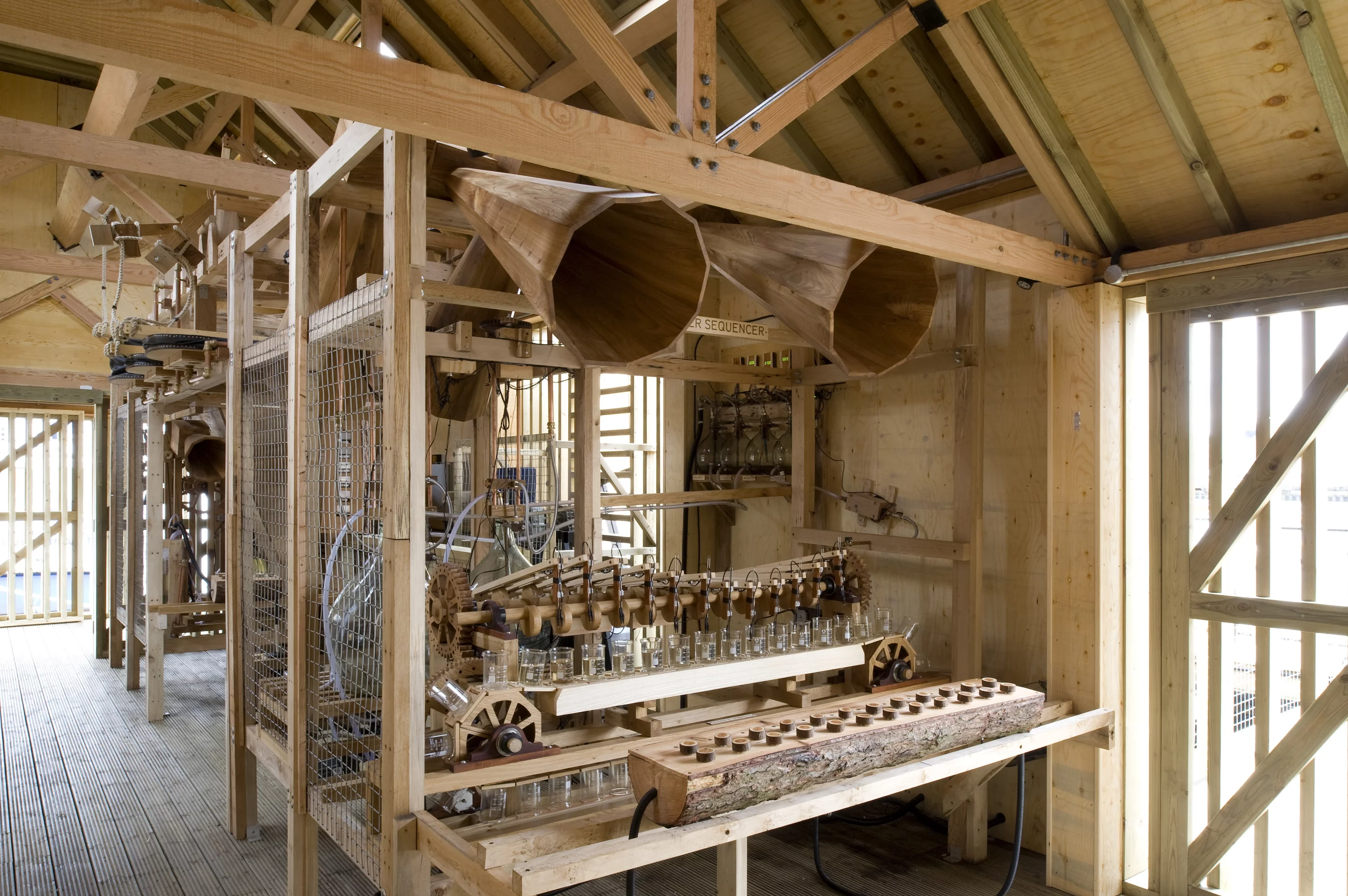 A (wonderfully named) Salinity Sampler Sequencer "plays" hourly river water samples with the assistance of a wooden conveyor belt and electronic sensors