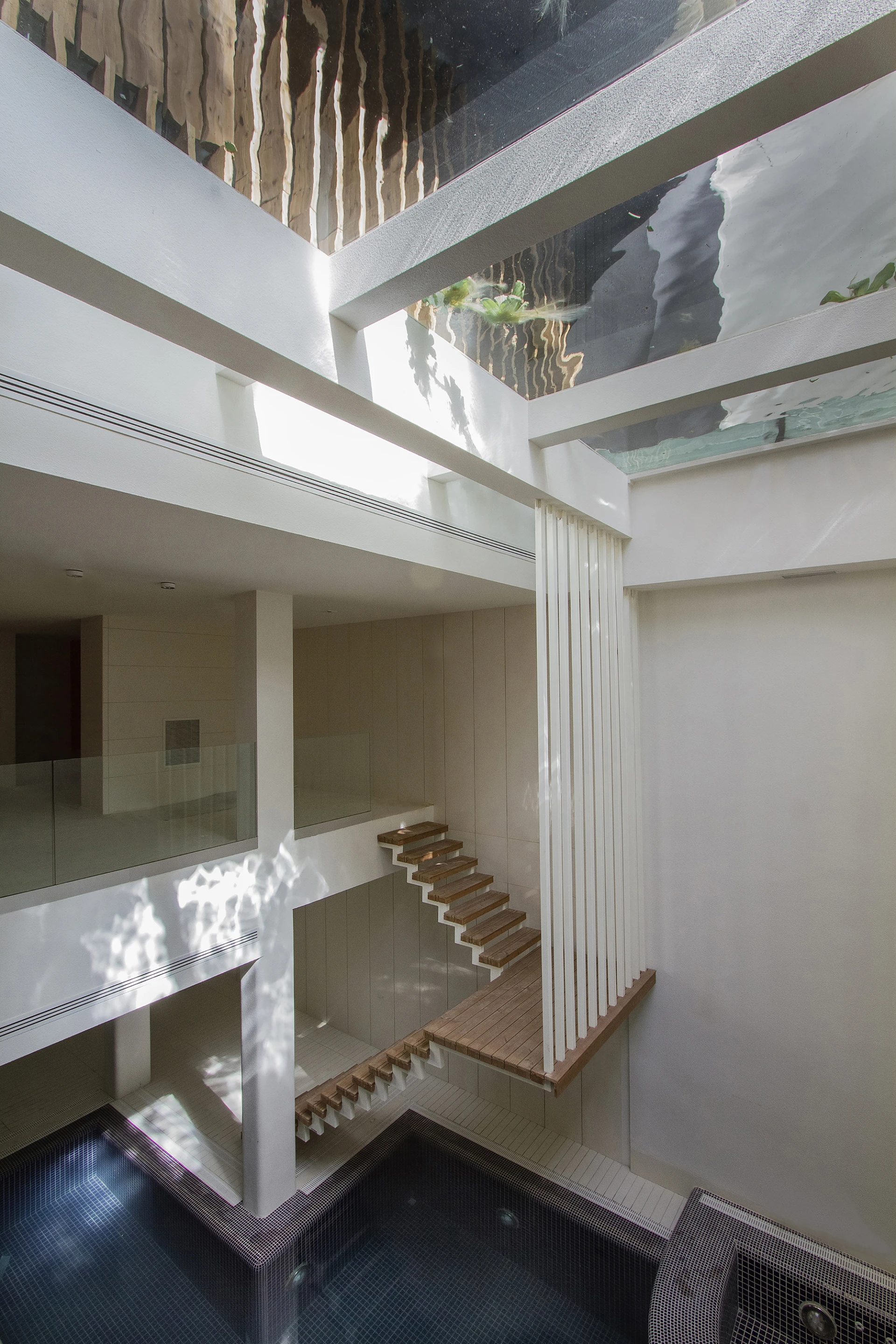 The first and second floors feature communal family spaces including the kitchen, lounge, and television room (Photo: Nextoffice)