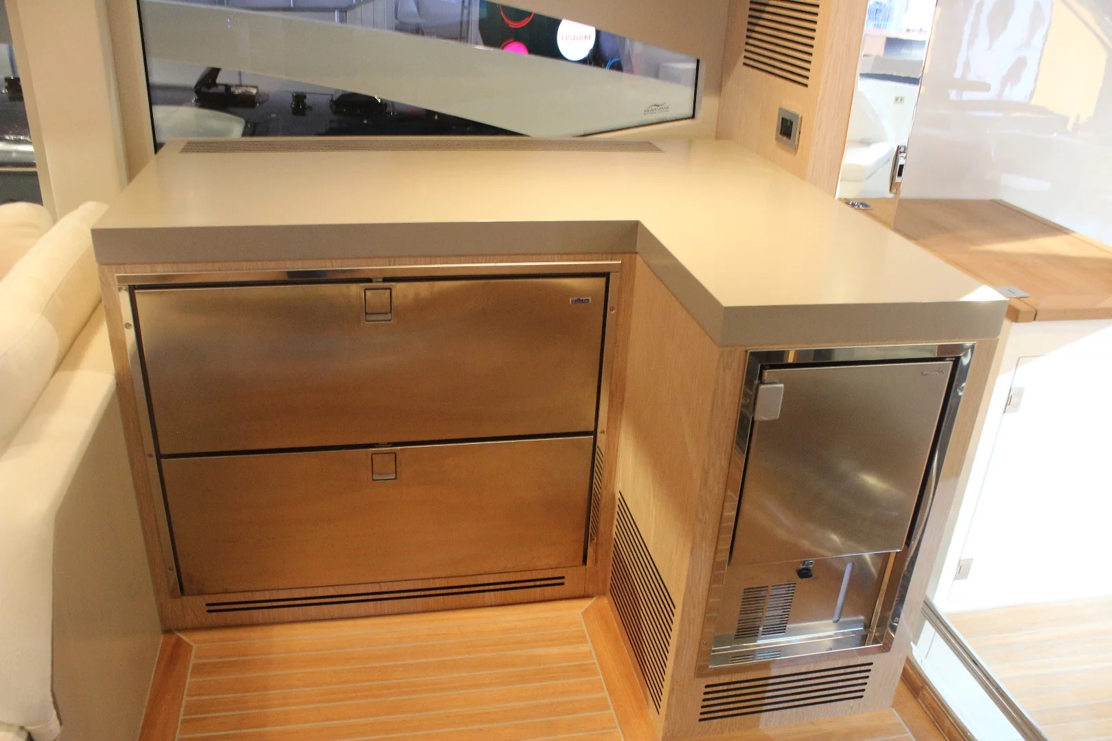 Being more accustomed to checking out motorhome interiors, we at first wondered where the cooktop and sink were before realizing the Adonis has a full galley below deck and this is just a drink cooler area