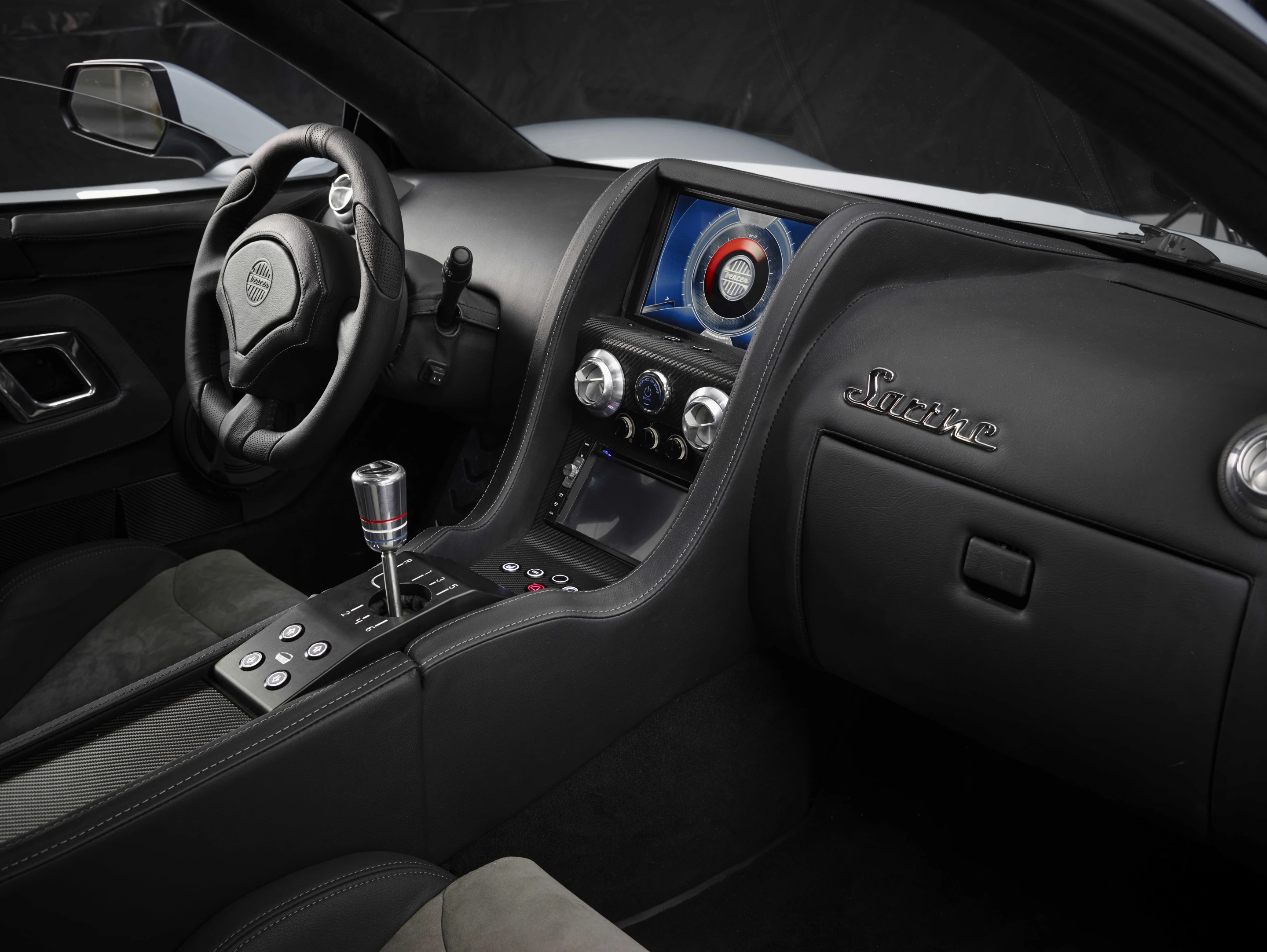 Sarthe interior features carbon fiber dashboard, brushed aluminum vents, leather steering wheel and a customizable Central Info System (CIS)