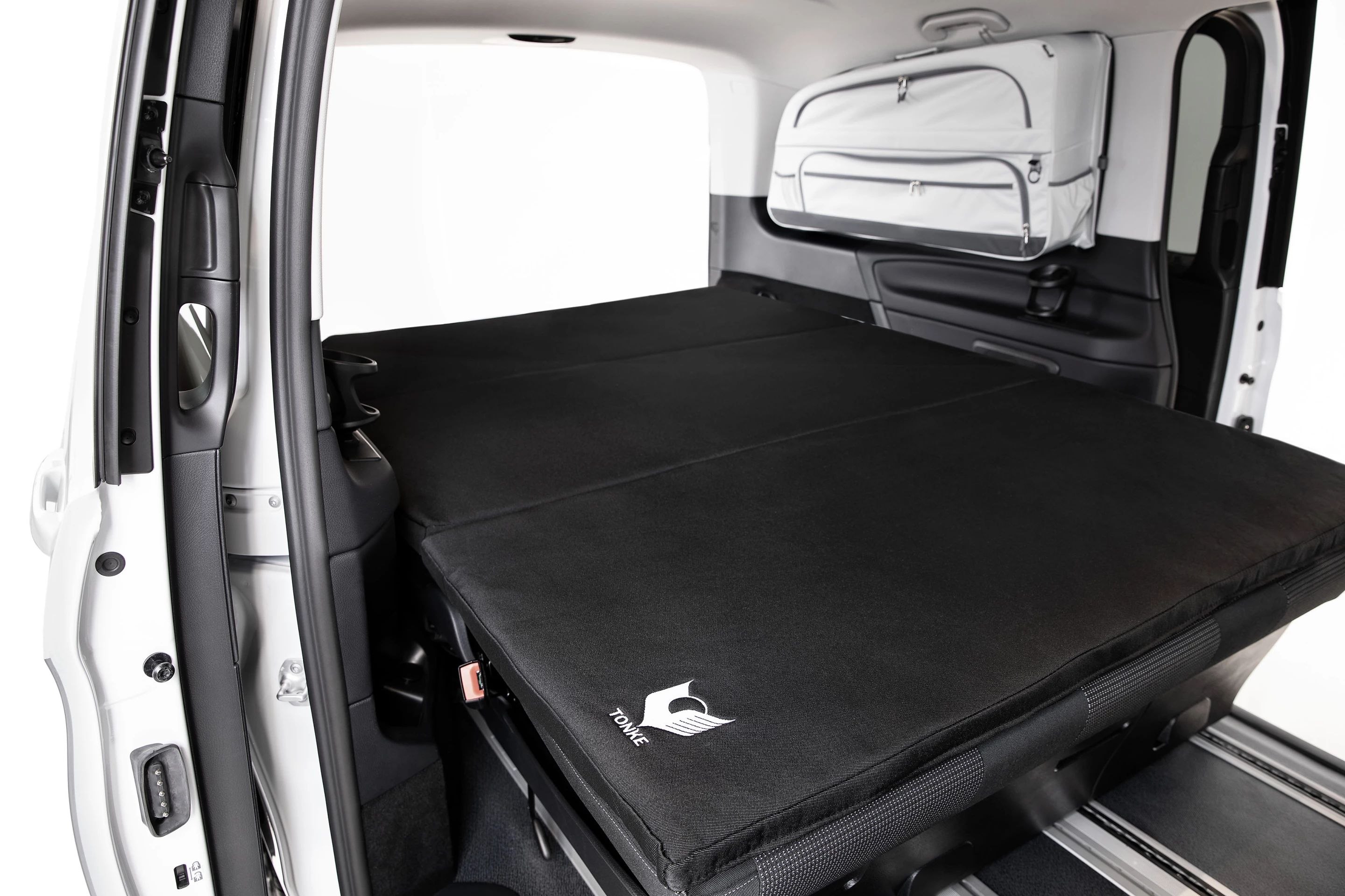 With no other built-in camper hardware, the EQV Adventure bench and bed stretches the width of the cabin