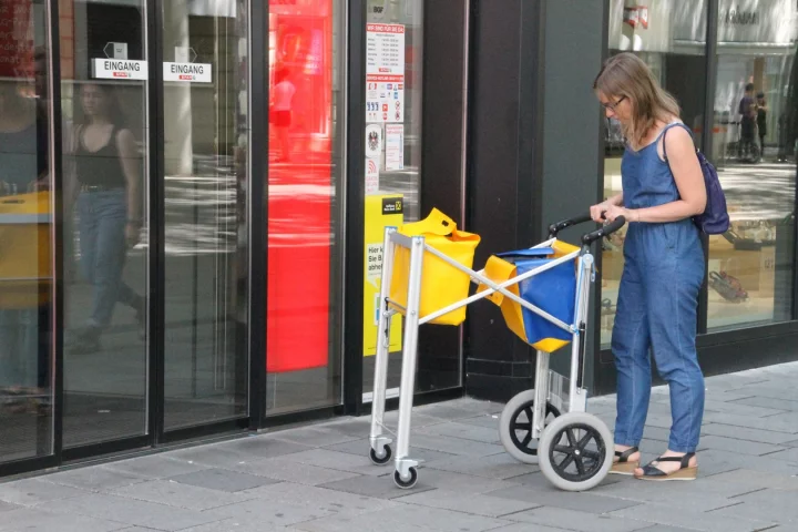 The multifunctional shopping trolley, being used as a grocery cart