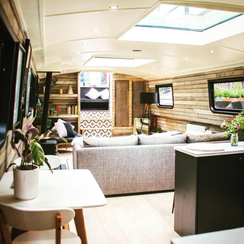The 60-foot-long (18 m) barge has been converted into a beautiful floating hotel suite