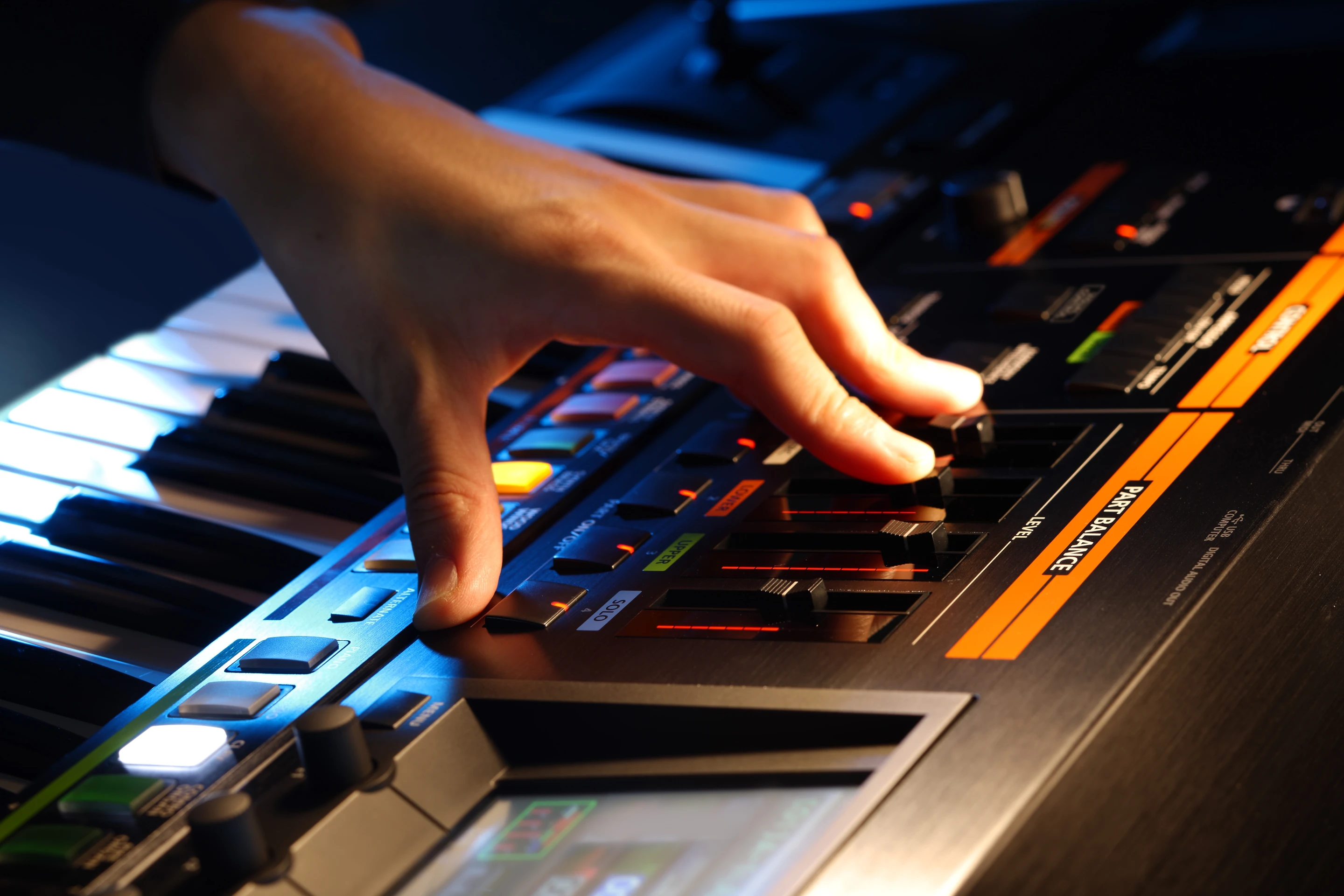 An LCD touchscreen interface is used in conjunction with the numerous control dials, knobs and buttons, the mixer sliders to control the instrument's sonic output
