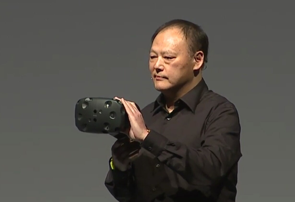 CEO Peter Chou holding the HTC Vive