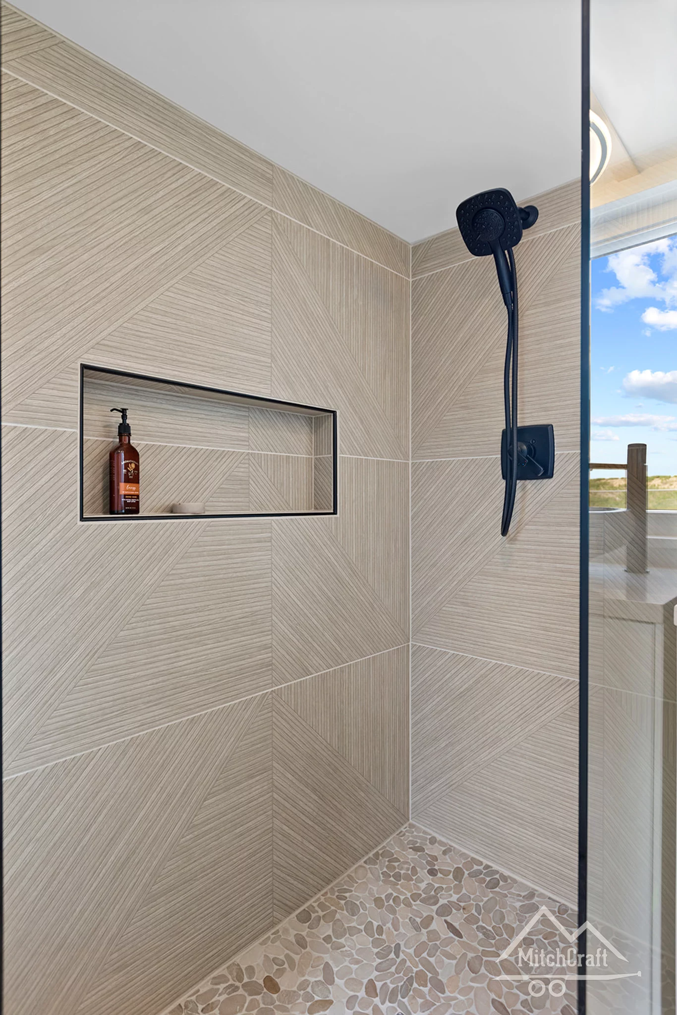 The bathroom in Casey's 32' x 10' Tiny Home boasts underfloor heating