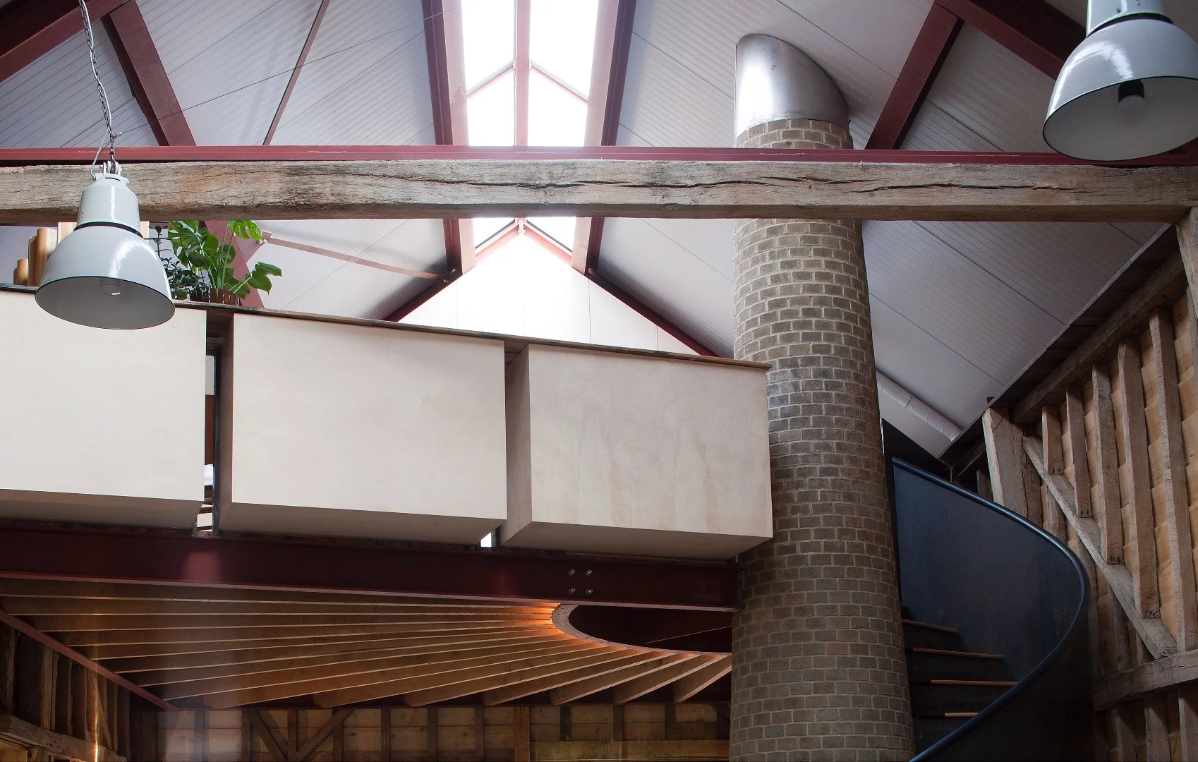 The mezzanine area and stone chimney