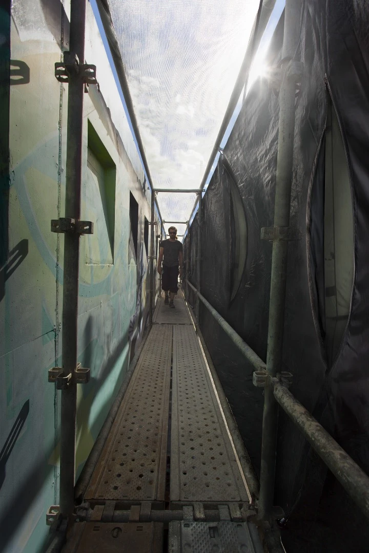 This installation, called Stealth Shelters, sits between public and private property suggesting an in-between liminal space where those without a home to go to could find a safe place at night