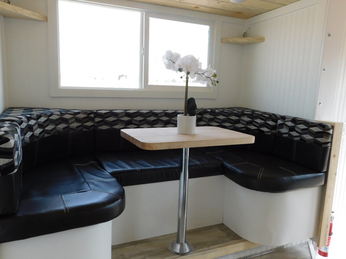 The Ozark's dining/living area shown is located in the slide-out section