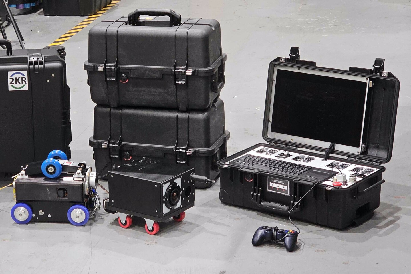 The robot (left) and one of its modules, alongside the remote-control hardware