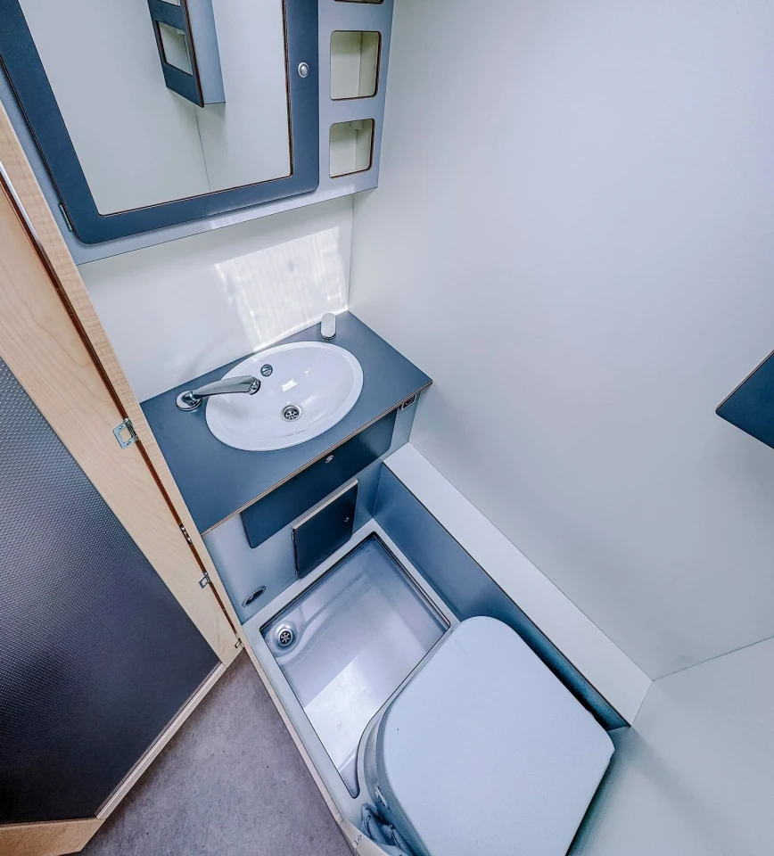 The bathroom would benefit from a fold-away sink but seems slightly better for showers than some of the other wet baths we looked at around Düsseldorf