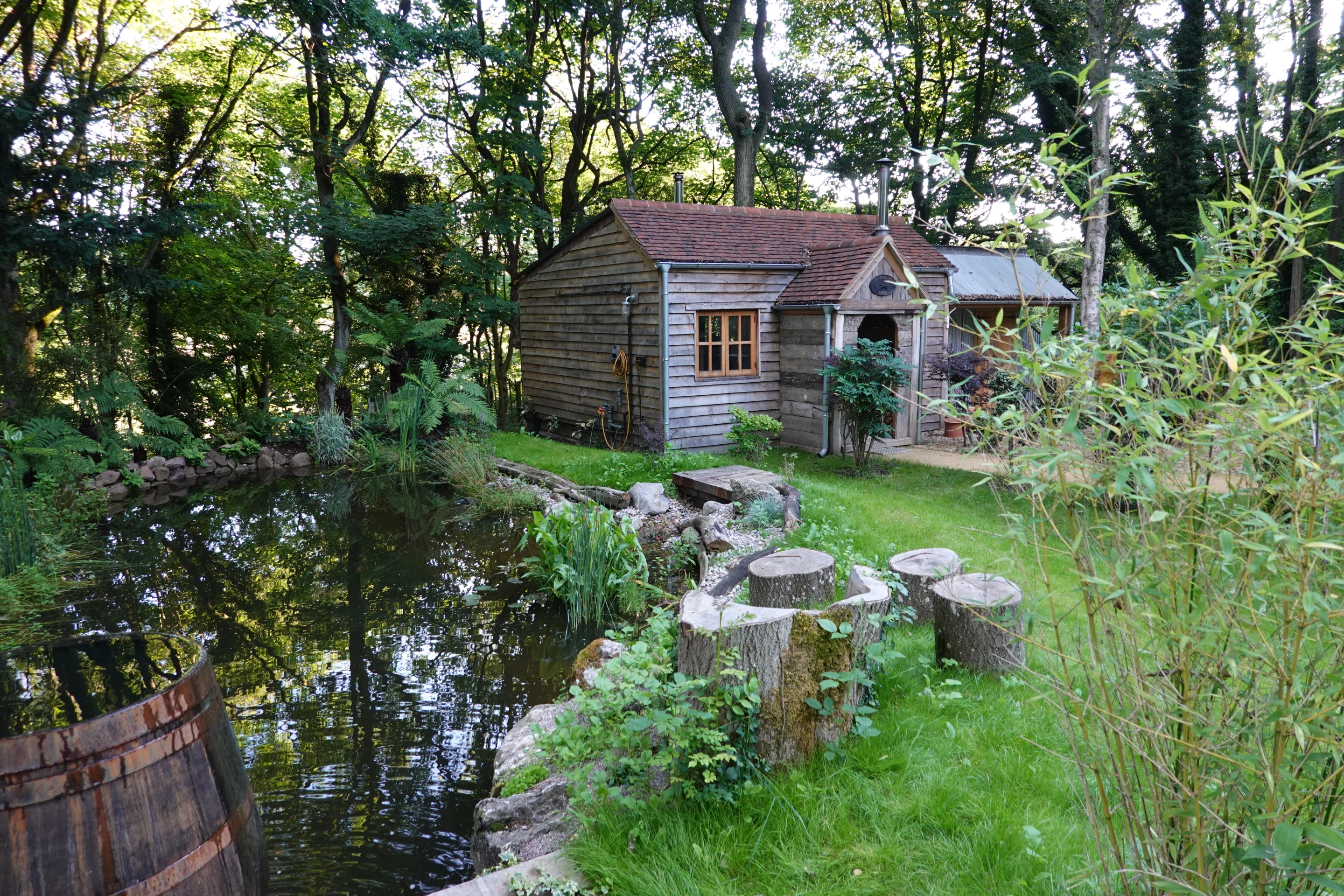 Pizza Folly, by Colin Naylor, includes a Japanese plunge bath, Italian wood fired pizza oven, and whisky bar, plus a sofa and a pair of double beds. It was built using recycled pallets and scaffold boards. The project is a finalist in the Pub/Entertainment category