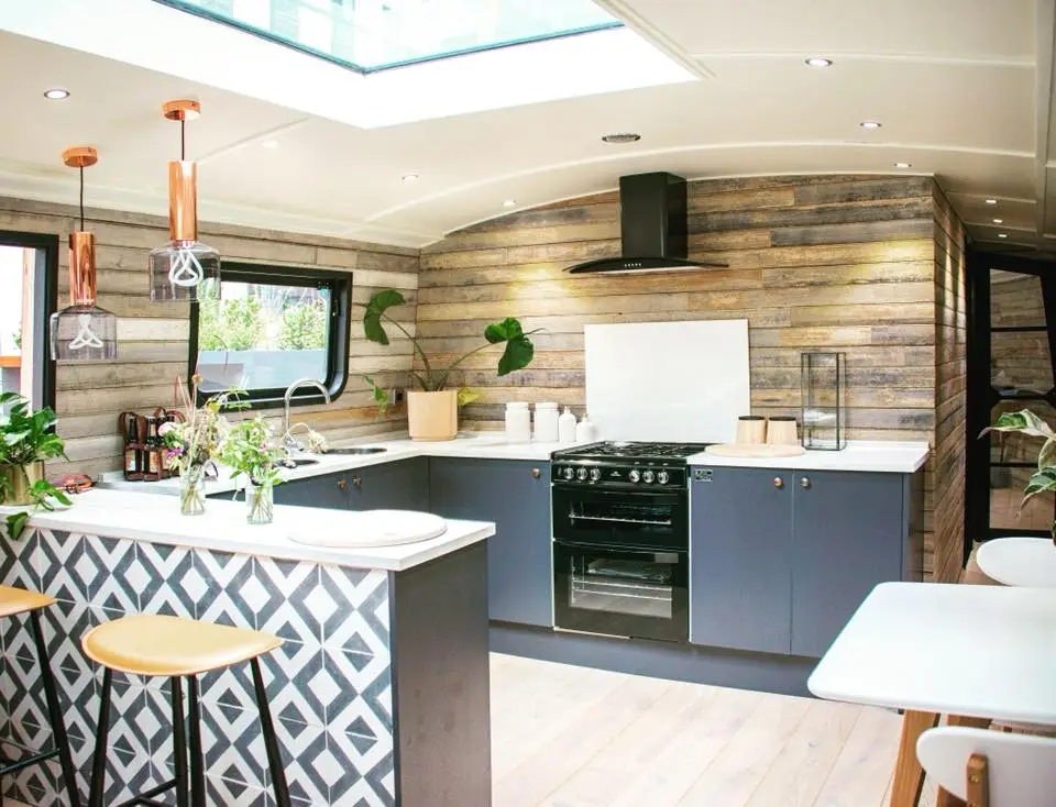 The houseboat is also furnished with marble top surfaces and industrial light fixtures