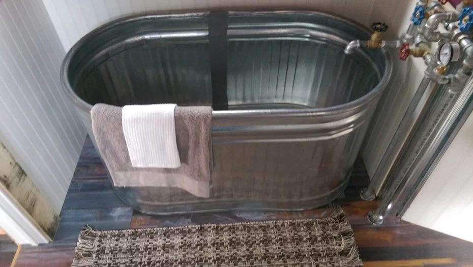 The Steampunk Adventure Home's interior features a total floorspace of 31 sq m (340 sq ft), and includes a galley kitchen, lounge area, bathroom, and and two loft-based sleeping areas accessed via stairs