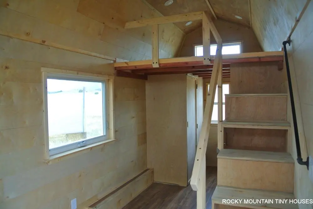 Storage-integrated stairs lead to the Bitterroot Valley's loft bedroom